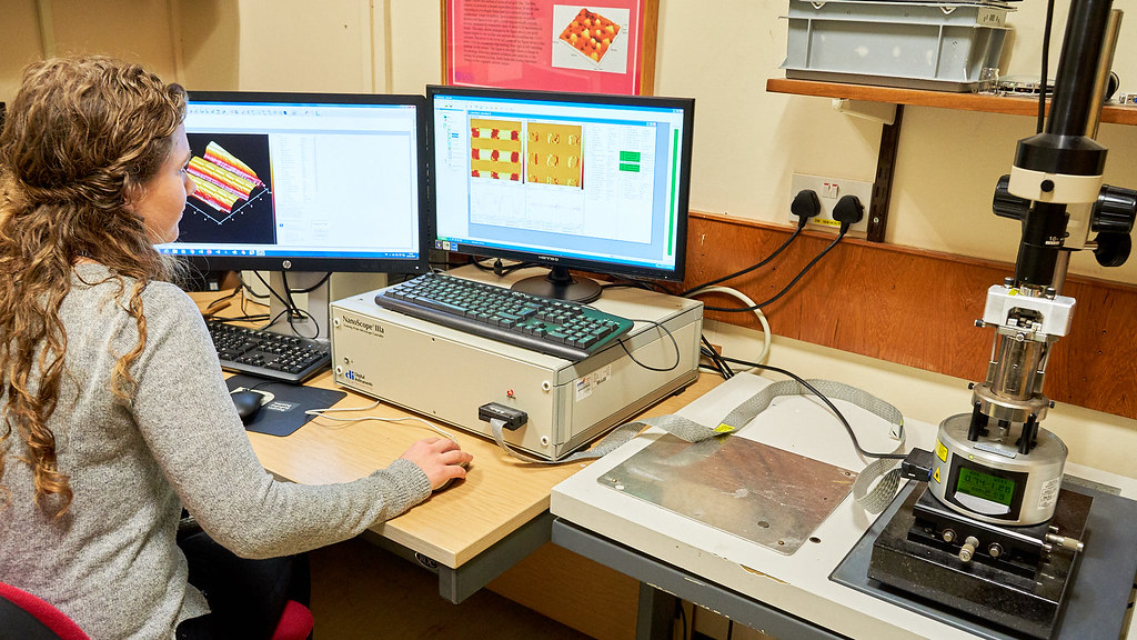 A researcher using the spectroscopy equipment